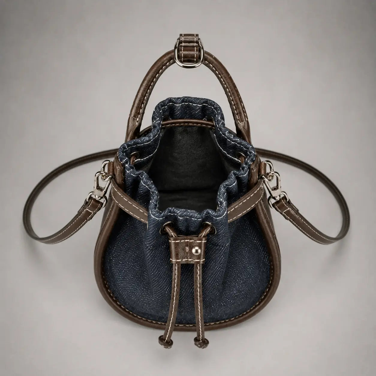 The Elowen Denim-Leather Mini Bucket Bag — Dark Indigo — open interior